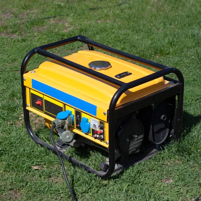 Yellow portable generator on grass